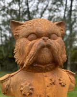 Close up of intricate detail on cat bust garden sculpture