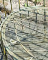 Close up of intricate seat detail on outdoor arbour bench