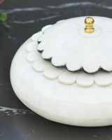 Close up of intricate scalloped edge detailing on jewellery box