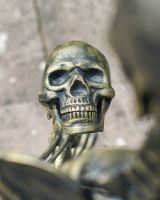 Close up of intricate skull detail on skeleton garden statue