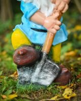 Close up of gardening detail on garden gnome Close up of gardening detail on garden gnome