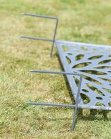 Close up of ground spike detail on decorative garden screen
