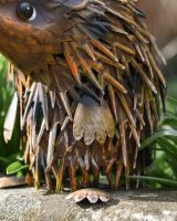 Close up of handpainted spine detail on steel garden ornament Close up of handpainted spine detail on steel garden ornament