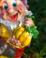 Close up of squash detail on colourful outdoor gnome sculpture
