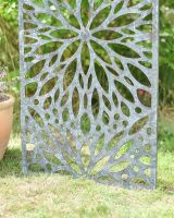 Close up of intricate cut out detail on freestanding garden screen