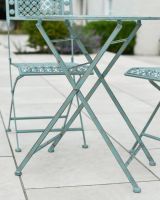 Close up of table leg detail on patio table and chairs set