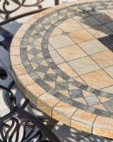 Close up of mosaic table top detail on 4 seater outdoor dining set
