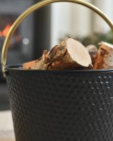 Close Up Of The Dimpled Steel Log Basket Details