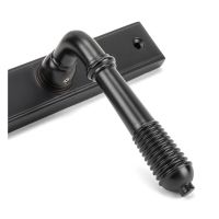 Close up of the Handle for The Reeded Slimline Lever Espagnolette Door Latch in Aged Bronze Close up of the Handle for The Reeded Slimline Lever Espagnolette Door Latch in Aged Bronze