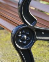 Sun Details On The Wood And Iron Garden Bench