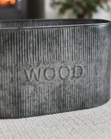 Close Up Of The "Wood" Motif On The Natural Steel Log Basket Close Up Of The "Wood" Motif On The Natural Steel Log Basket