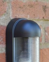 Close up of black detailing on garden wall light
