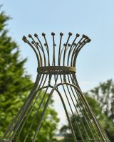 Close up of ornate top detailing on rustic arbour