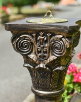 Close up of ornate detailing on garden plinth