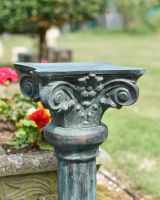 Close up of ornate detail on garden plinth