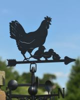Close up of hen and chicks detail on black weathervane