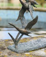 Close up of Flock of Flying Ducks Garden Sculpture 