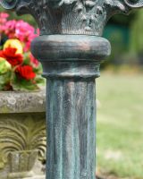 Close up of verdigris finish on garden sundial column