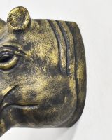 Close up of intricate detail on gold safari animal wall bust