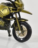 Close up of wheel detail on recycled home decor sculpture