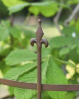 Close up of spindle detail on ornate tree guard Close up of spindle detail on ornate tree guard