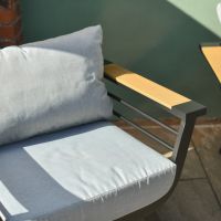 Close up of modern wood effect detailing on five seater patio lounge furniture set