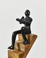 Close up of person detail on black cast aluminium home decor sculpture