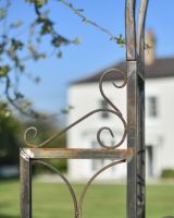 The Scroll Details On The Ornate Natural Lacquer Aesica Arch With Gate