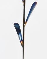 Close up of stem detail on recycled metal tulip ornament Close up of stem detail on recycled metal tulip ornament