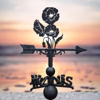 Cluster of Poppies Weathervane in Use by the Sea Cluster of Poppies Weathervane in Use by the Sea