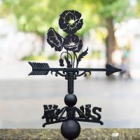 Cluster of Poppies Weathervane in Situ in the Garden Cluster of Poppies Weathervane in Situ in the Garden