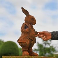 Side view of Cast Iron Hare with Pipe Sculpture 