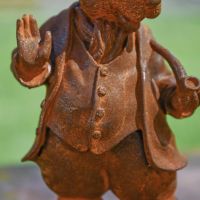 Close up of body on Rustic Cast Iron Hare with Pipe Sculpture-