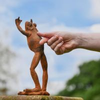 Rustic Cast Iron "High Five" Frog Sculpture in Garden Rustic Cast Iron "High Five" Frog Sculpture in Garden