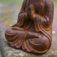 Close up of Seated Positioning on Rustic Cast Iron Garden Sculpture 
