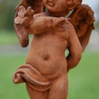 Close up of detailing on Rustic Cast Iron Cherub 