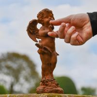Cherub with Bird Sculpture in Cast Iron 