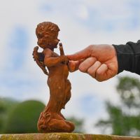 Side view of Rustic Cast Iron Winged Cherub 