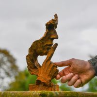 Rustic Cast Iron Sculpture with Abstract Face 