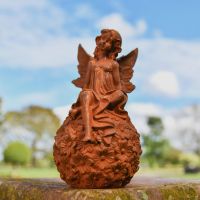 Rustic Cast Iron Sitting Fairy Sculpture in Situ