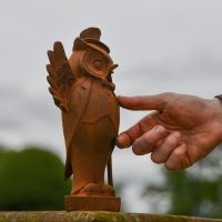 Rustic Cast Iron Owl with Hand for Scale 