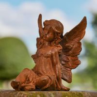 Rustic Cast Iron Posed Fairy Sculpture in Garden