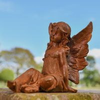 Side view of Rustic Cast Iron Posed Fairy Sculpture
