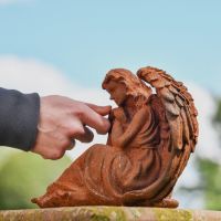 Side view of Angel in Thought