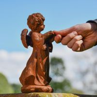 Side view of Cast Iron Angel Reading 