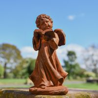 Rustic Cast Iron Angel Reading Sculpture in Garden Setting 