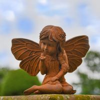 Rustic Cast Iron Fairy with Flower Sculpture in Situ Rustic Cast Iron Fairy with Flower Sculpture in Situ