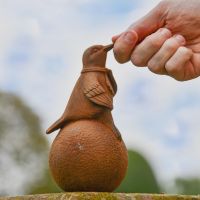 Rustic Iron Sitting Hummingbird with Hand for Scale 