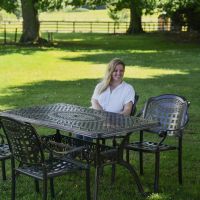 Female Seated at Antique Copper "Hestercombe" Four Seater Furniture Set 