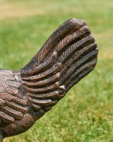 Close up of tail detail on cockerel garden sculpture